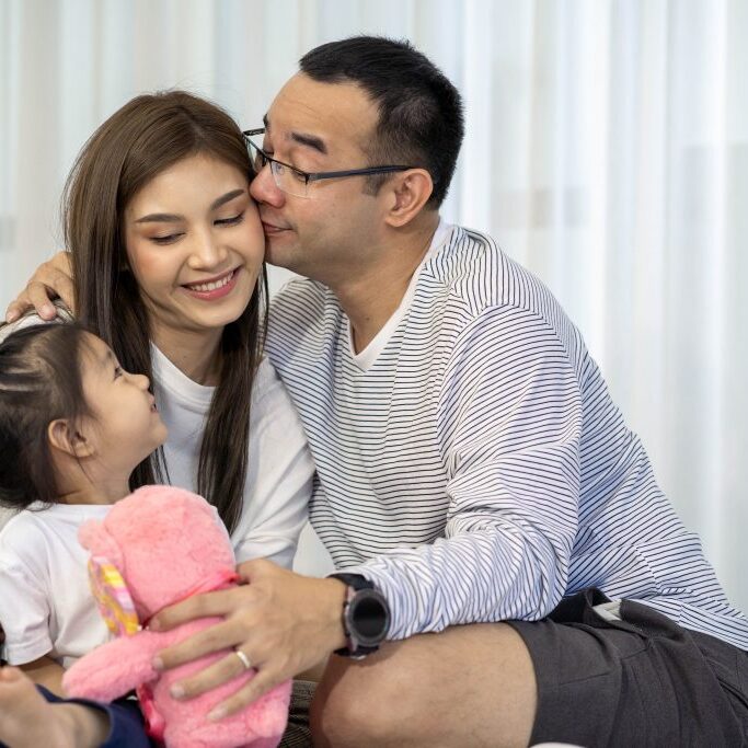 photo of happy family with daughter